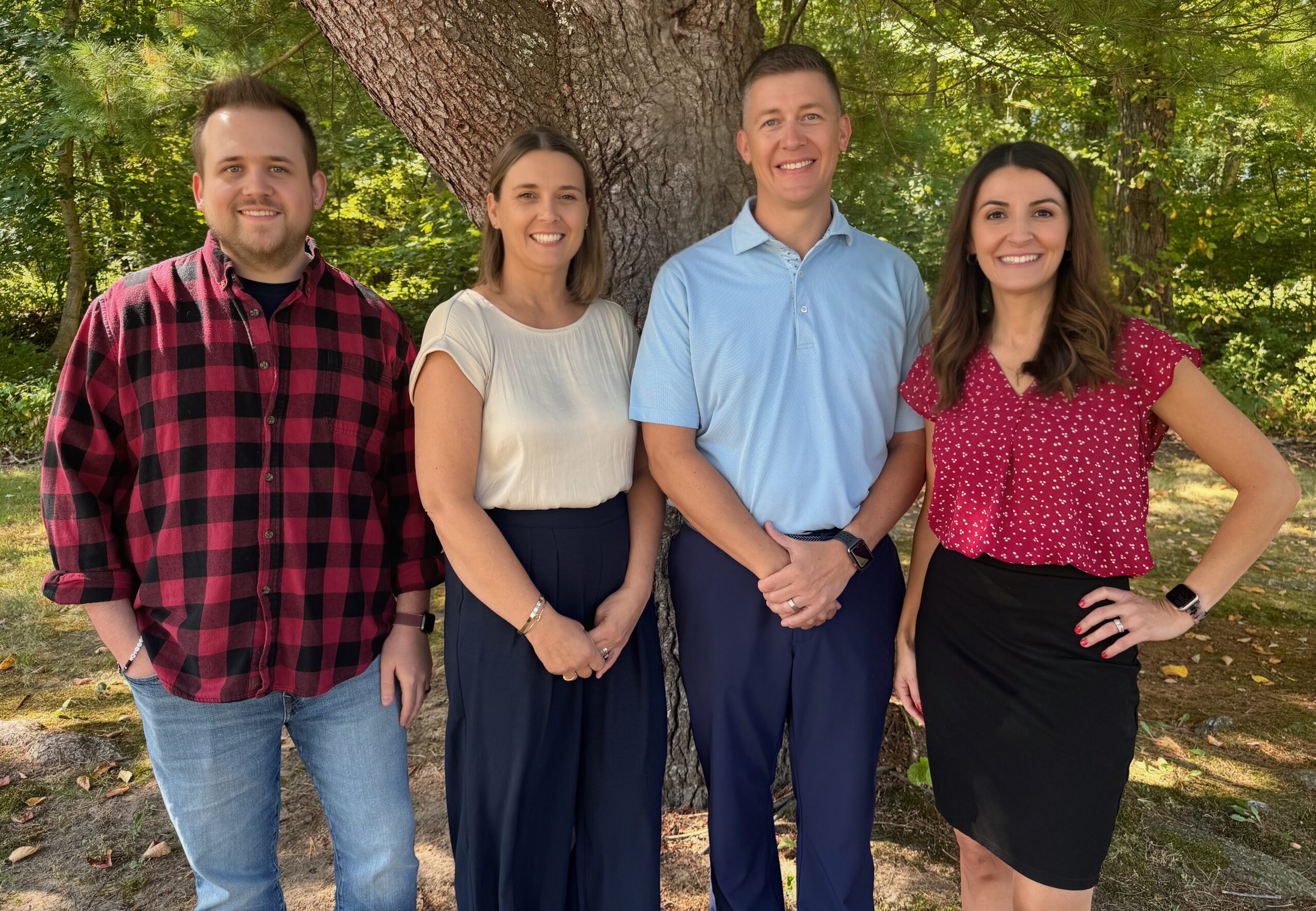 Group 2 Company owner Keith Tatlock surrounded by his family supporting him and his personalized financial planning business